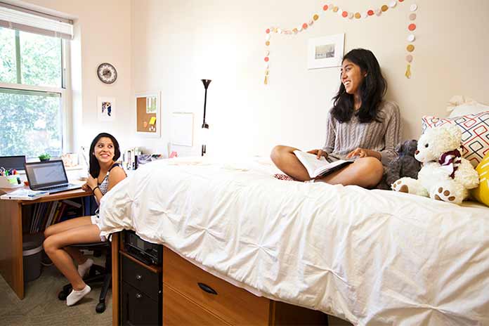 Two Oxford students in a residence hall room